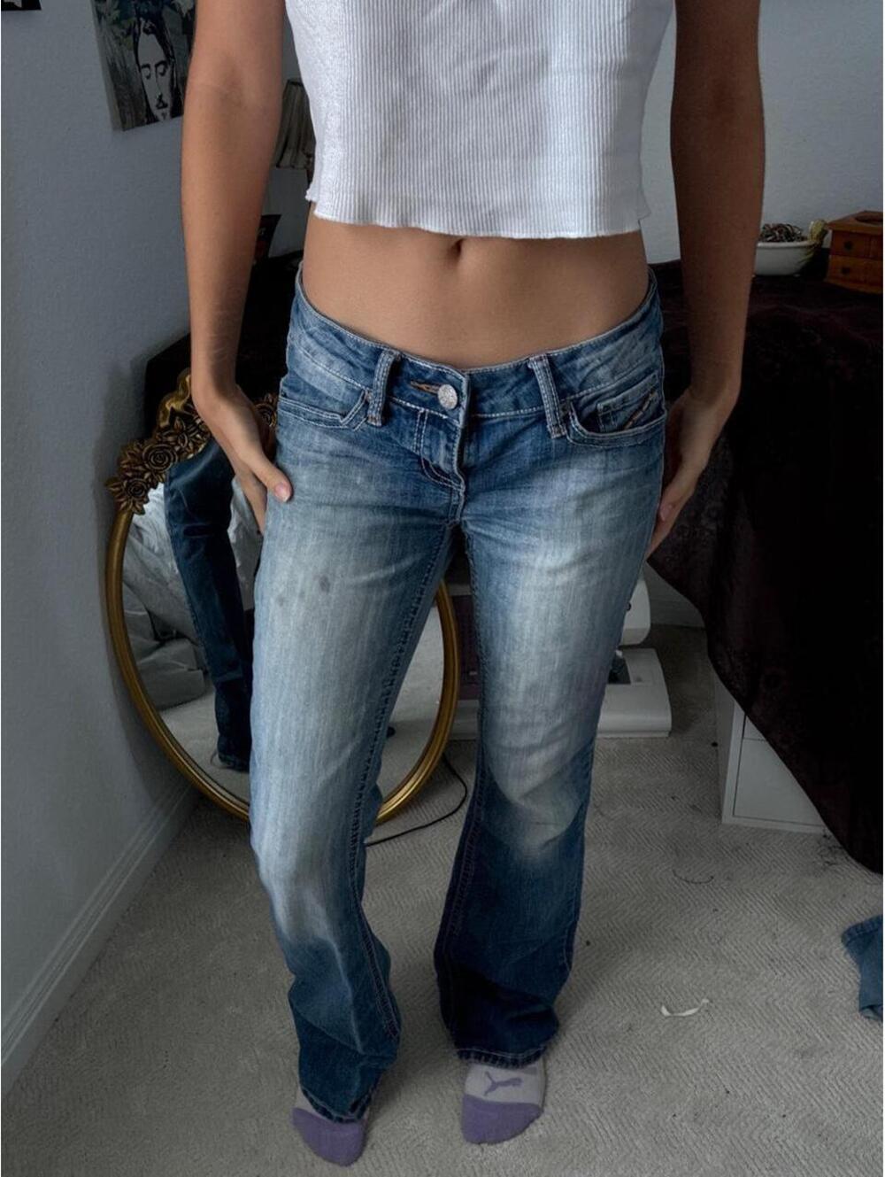 Low rise blue jeans with a cute back design